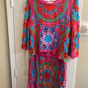 Crochet dress/top with short front and long back.